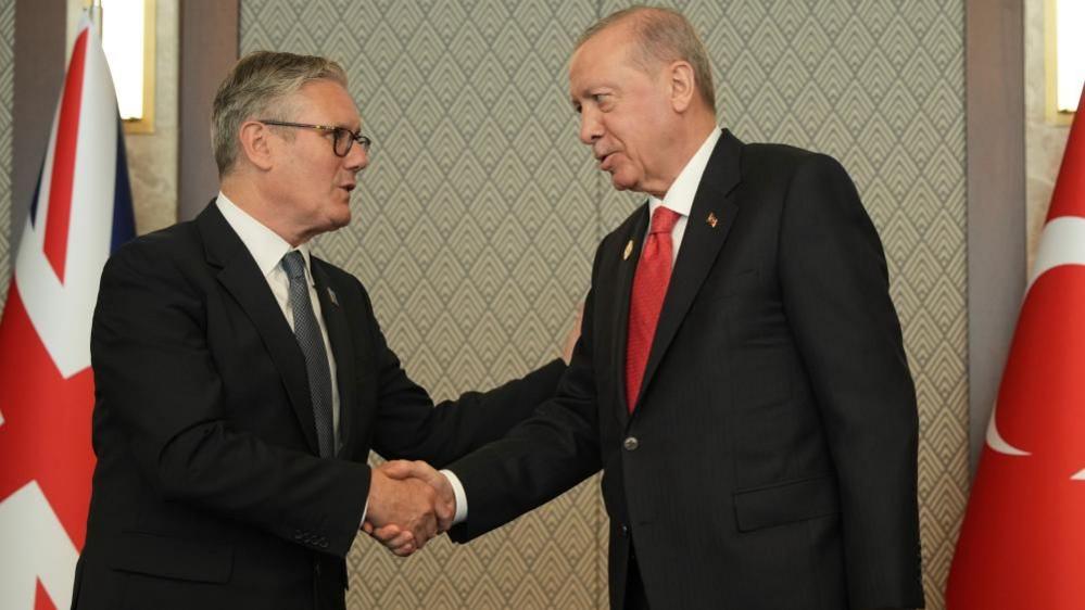 Keir Starmer Receives Revolver Gifted by Turkish President at NATO Summit