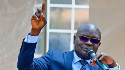 Uganda's Electoral Chief Faces Threats Amid Controversial Election